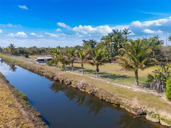 a view of a swimming pool and an outdoor space