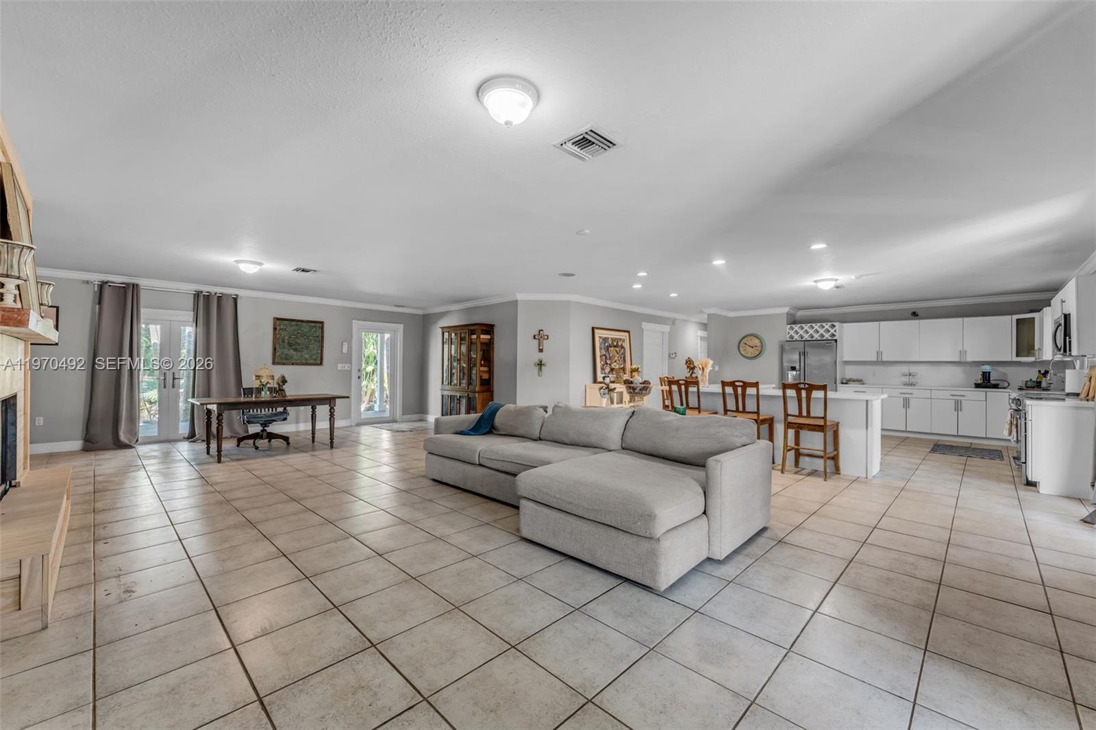 20076 Southwest 190th Street Miami, FL 33187 - Photo 10 of 32 a living room with furniture and a table