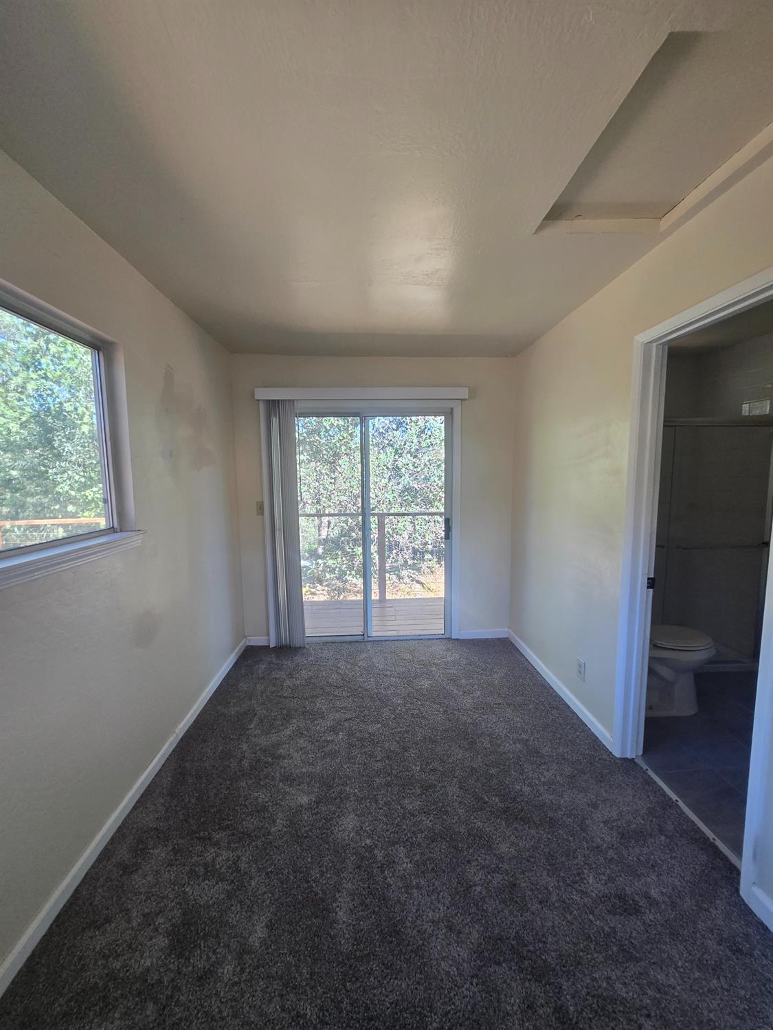 10601 Lime Kiln Road Grass Valley, CA 95949 - Photo 35 of 79 Second ensuite also features a sliding glass door that goes directly onto the expansive back deck.