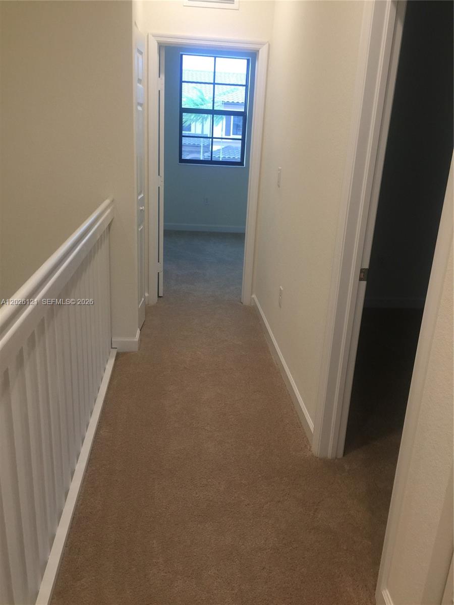 9307 West 33rd Way Hialeah, FL 33018 - Photo 12 of 23 a view of hallway with windows