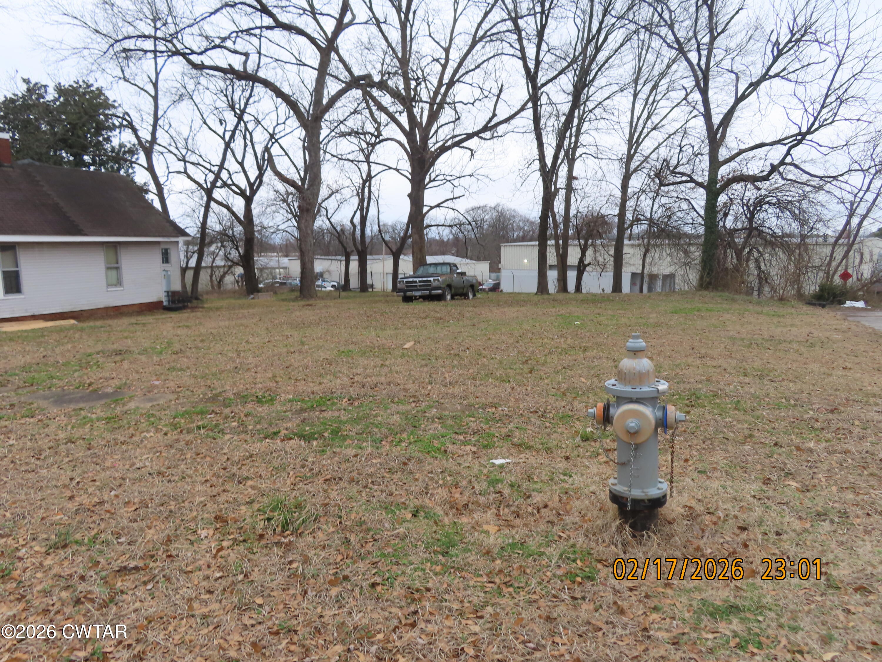 243 Oak Street Jackson, TN 38301 - Photo 5 of 8 a fire hydrant in the middle of a field