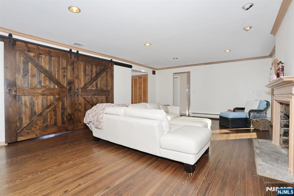 28 Bear Mountain Road Ringwood, NJ 07456 - Photo 14 of 50 a large white bed sitting in a room next to a window