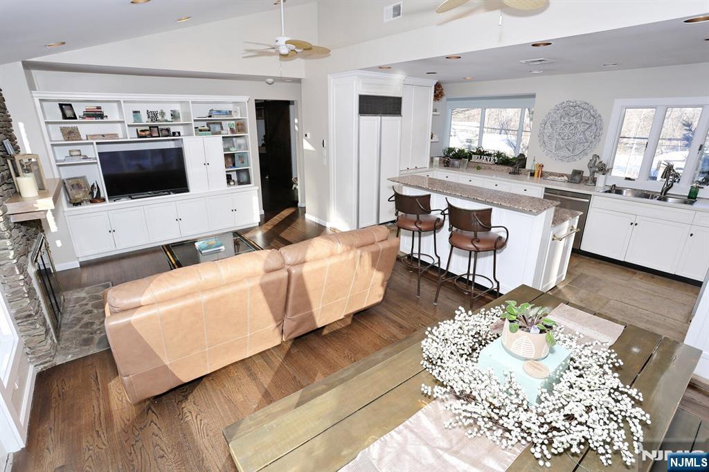 28 Bear Mountain Road Ringwood, NJ 07456 - Photo 24 of 50 a living room with furniture and flat screen tv
