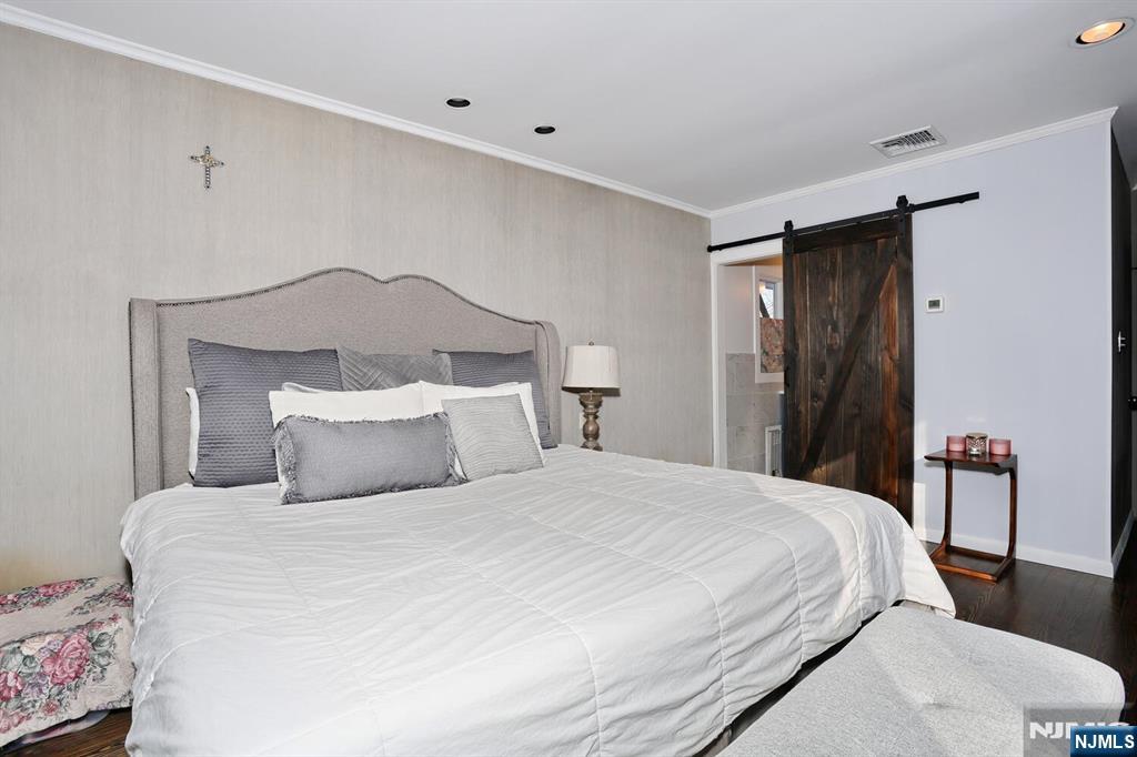 28 Bear Mountain Road Ringwood, NJ 07456 - Photo 29 of 50 a bedroom with a bed and a painting