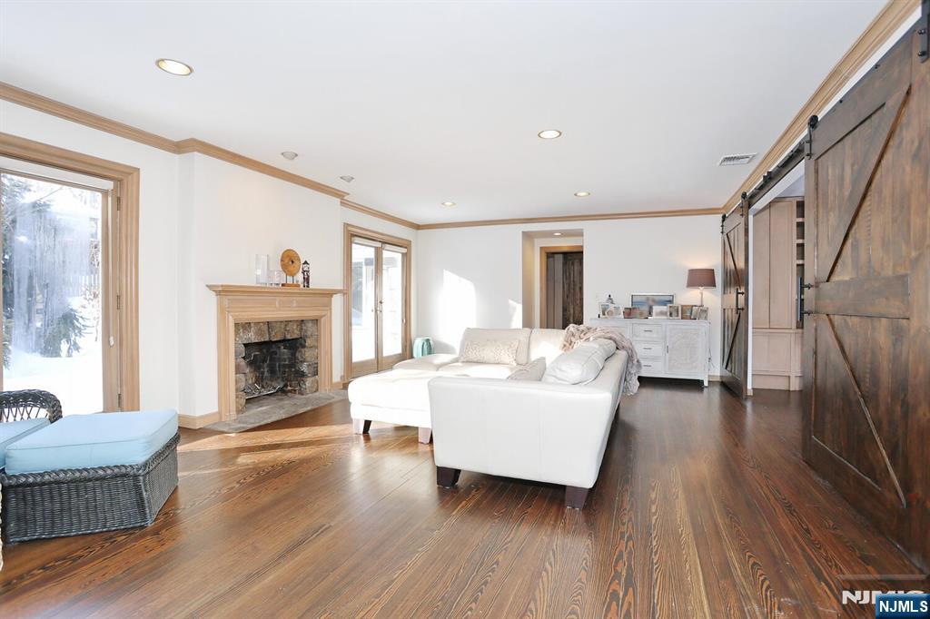 28 Bear Mountain Road Ringwood, NJ 07456 - Photo 6 of 50 a living room with furniture and a fireplace