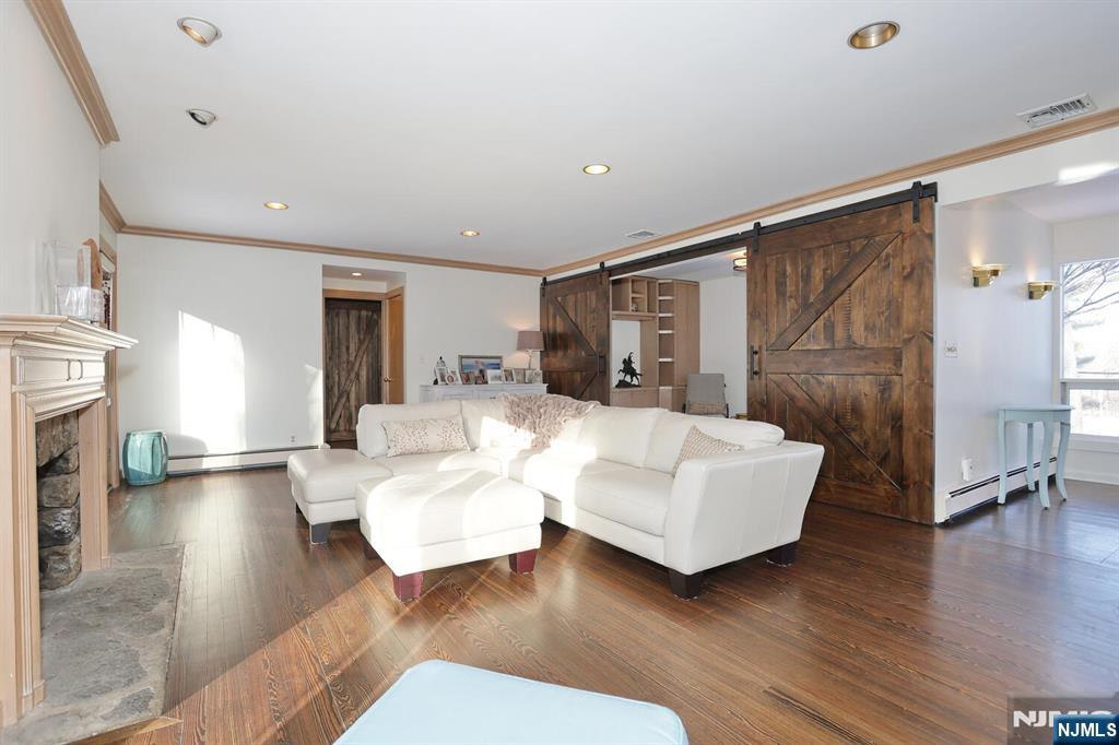 28 Bear Mountain Road Ringwood, NJ 07456 - Photo 7 of 50 a living room with furniture and a fireplace