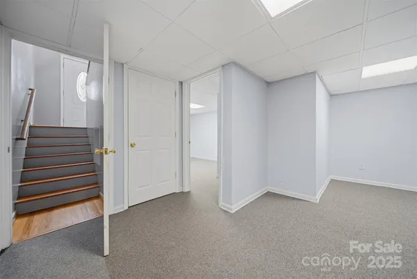 an empty room with a ceiling fan