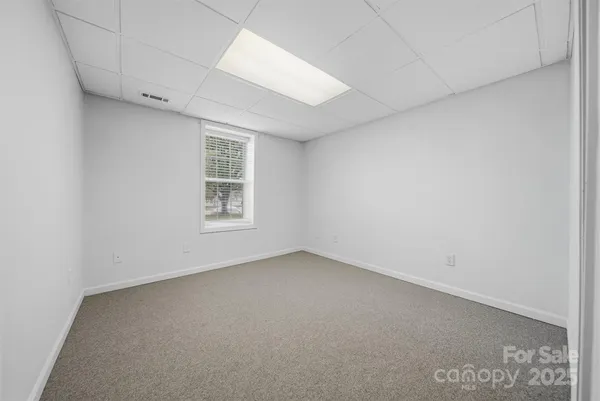 a balcony with wooden floor and fence