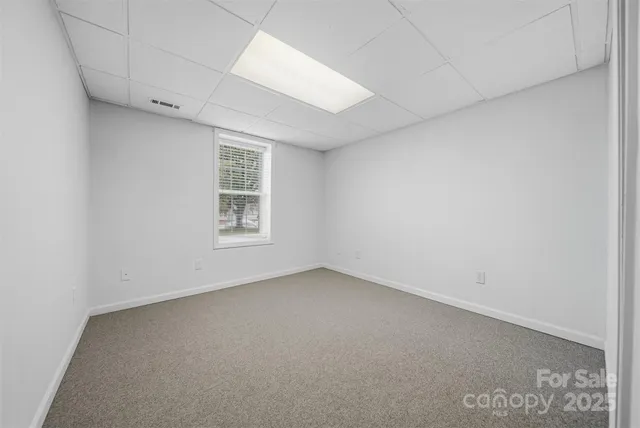 a balcony with wooden floor and fence
