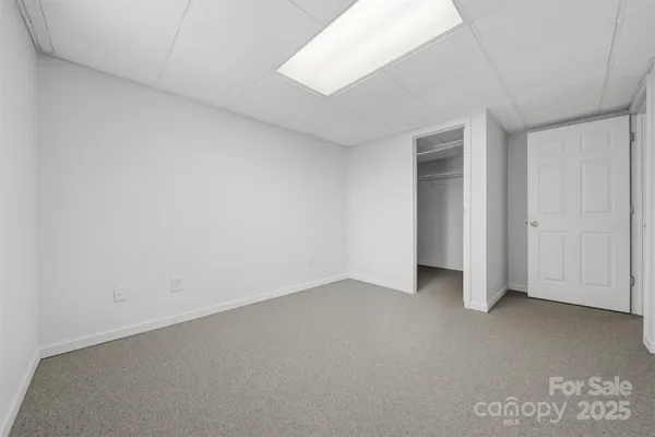 a view of a swimming pool with a yard