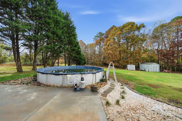 a view of a backyard with a sitting area
