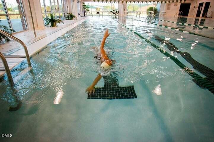 175 Carvins Cove Clayton, NC 27520 - Photo 9 of 10 a vase of flowers sitting on a table