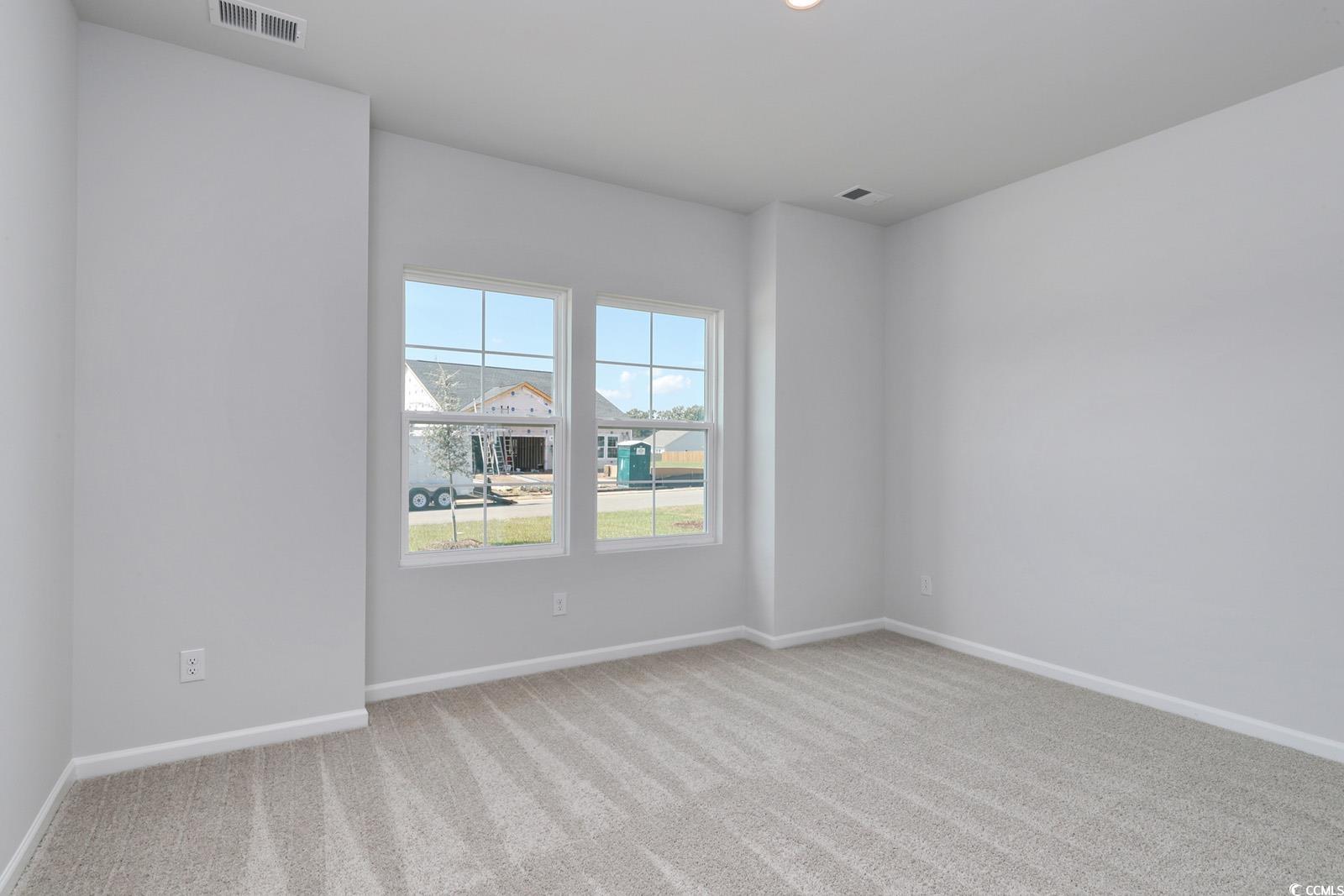 331 Garden Grove Street Conway, SC 29526 - Photo 15 of 24 Empty room featuring light colored carpet and baseboards