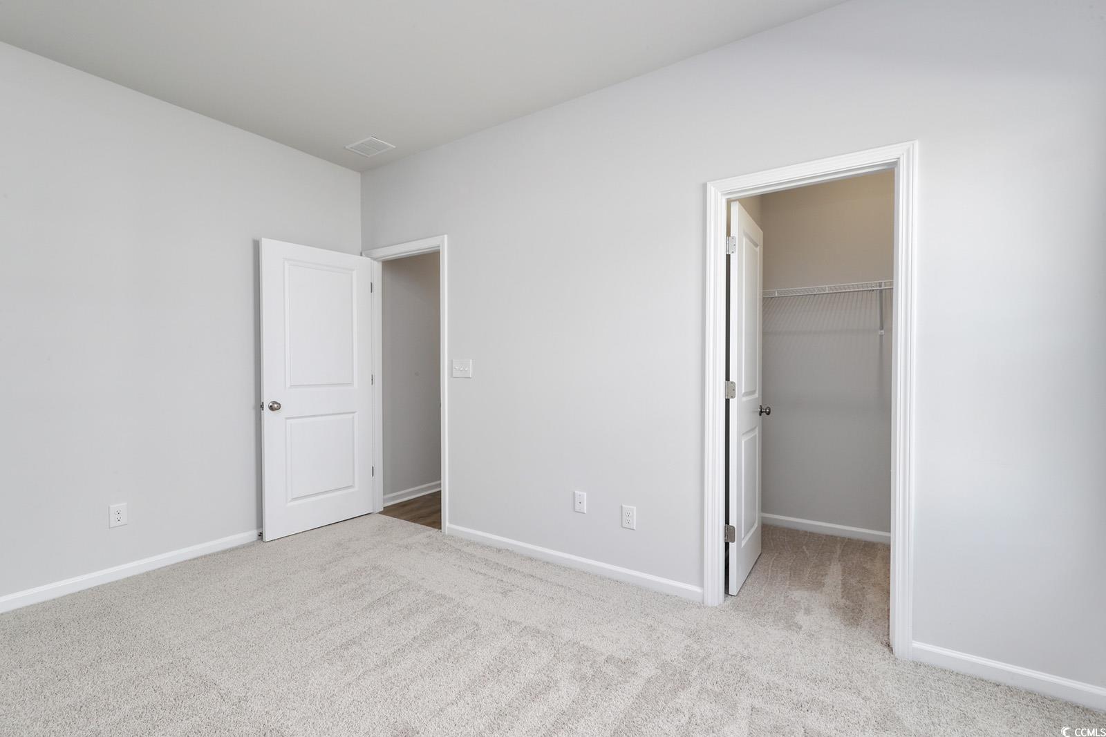 331 Garden Grove Street Conway, SC 29526 - Photo 18 of 24 Unfurnished bedroom with light carpet and a spacious closet