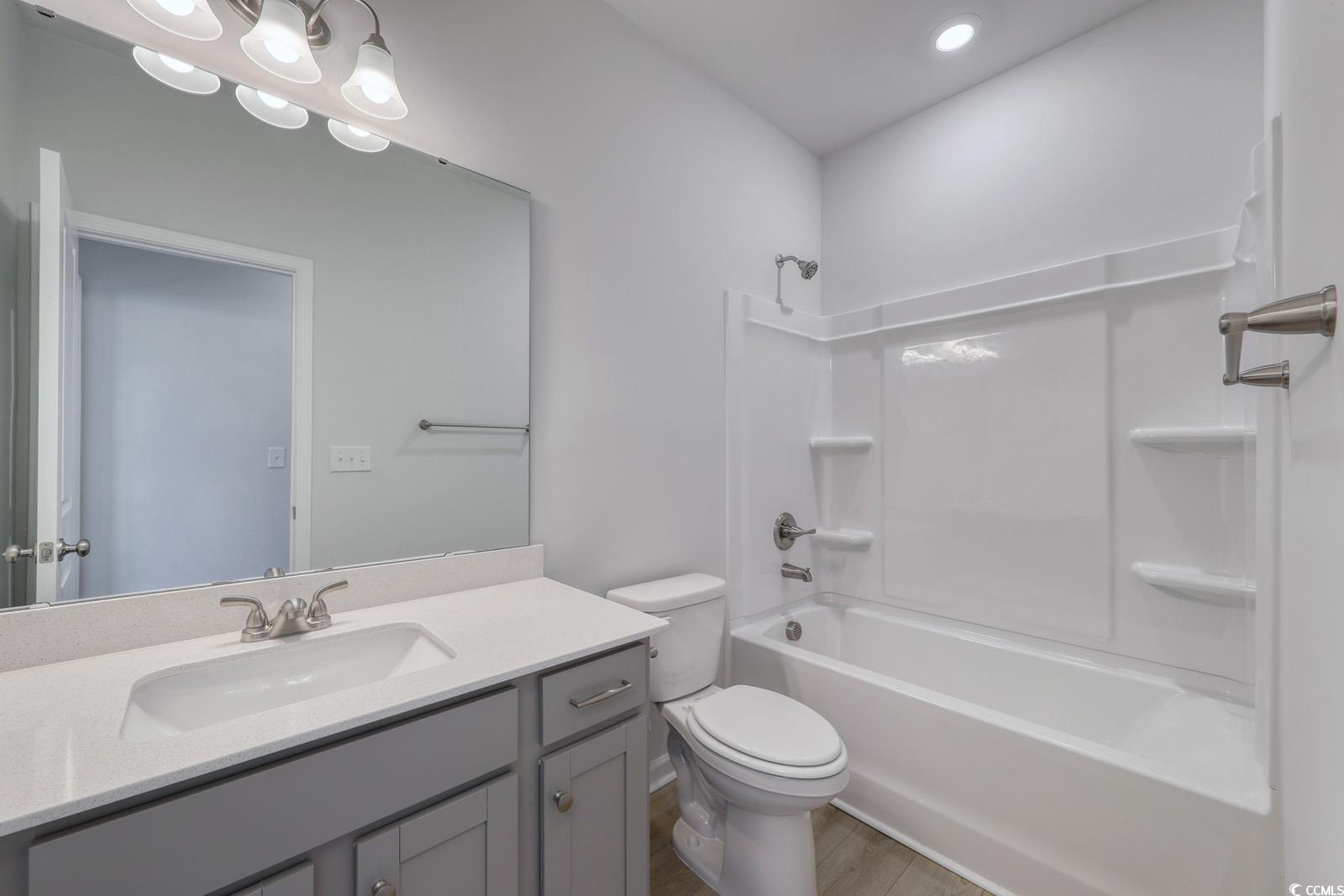 331 Garden Grove Street Conway, SC 29526 - Photo 19 of 24 Bathroom featuring washtub / shower combination, vanity, and recessed lighting