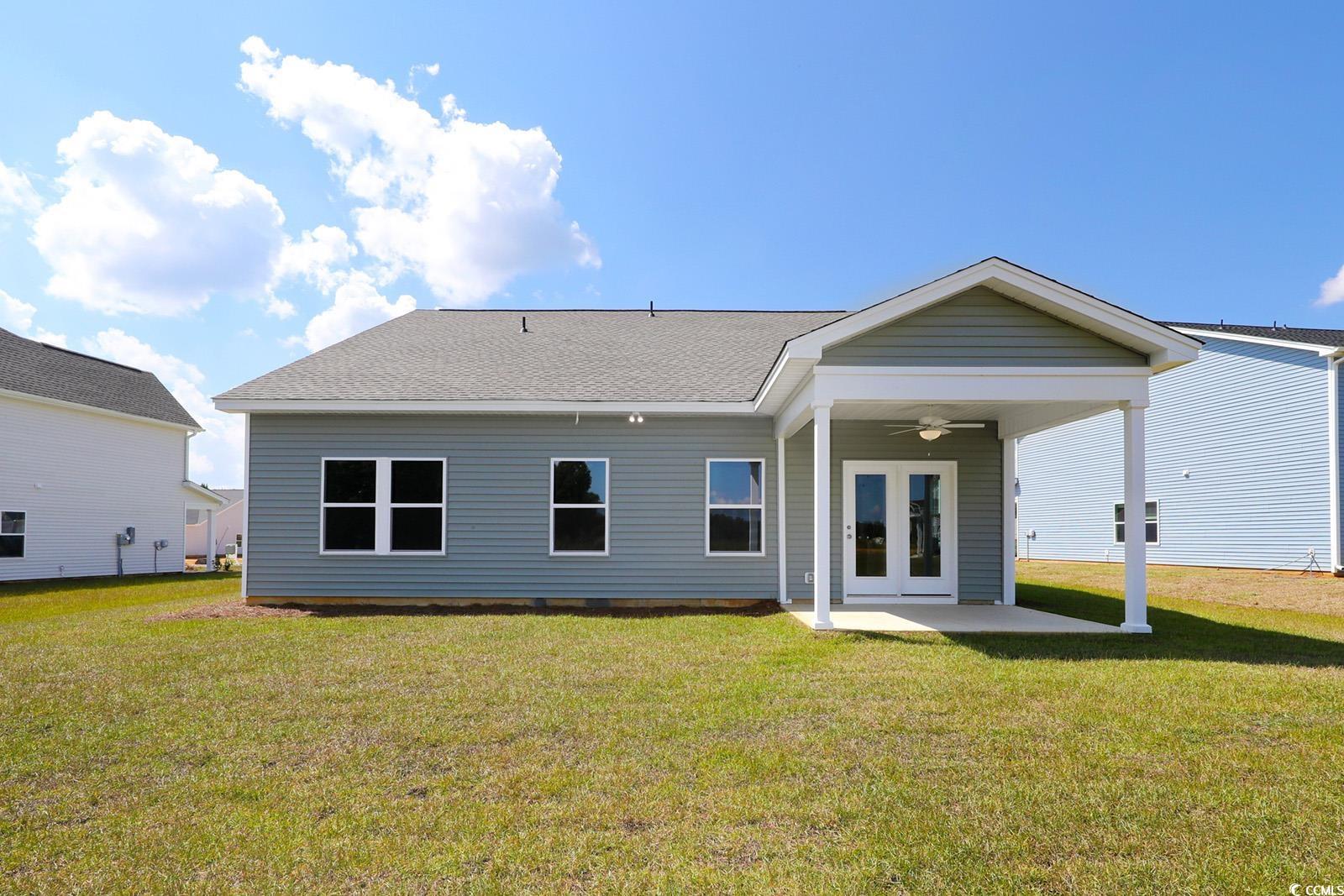 331 Garden Grove Street Conway, SC 29526 - Photo 23 of 24 Rear view of house featuring a ceiling fan, a yard, a patio area, a shingled roof, and french doors