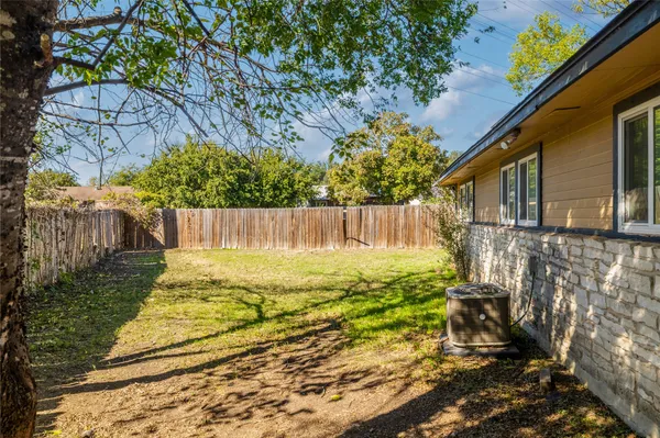 a view of a backyard of the house