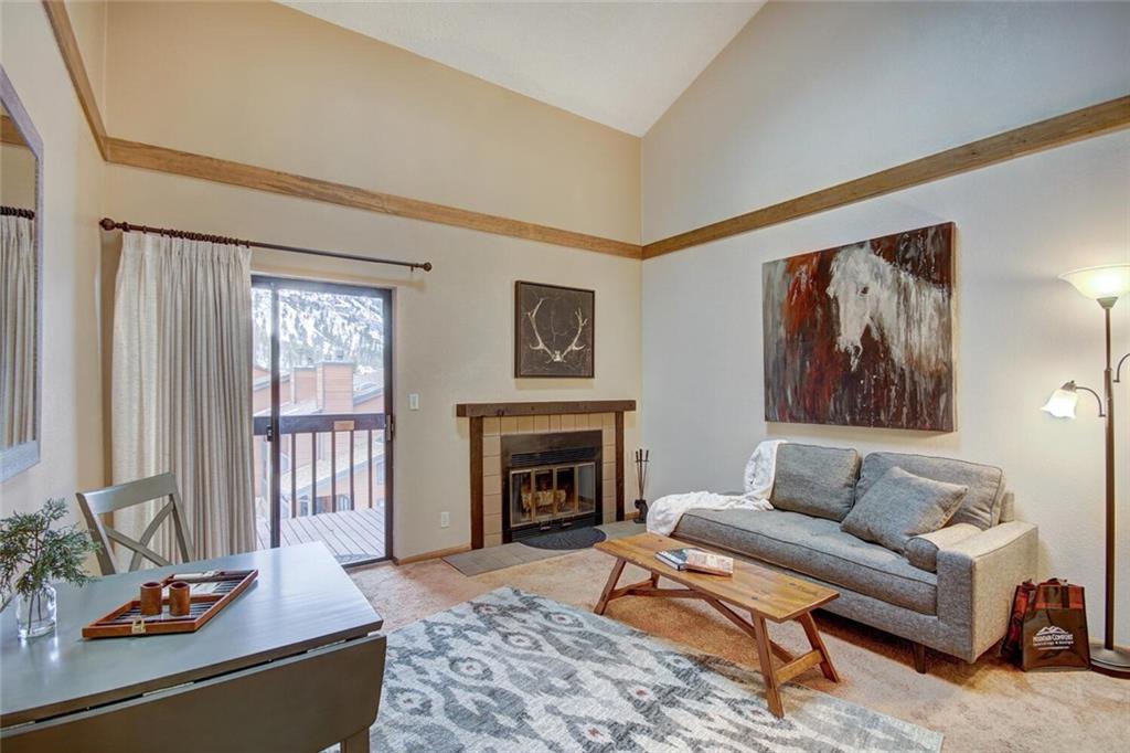 500 Bills Ranch Road, Unit 321 Frisco, CO 80443 - Photo 2 of 27 a living room with furniture and a fireplace