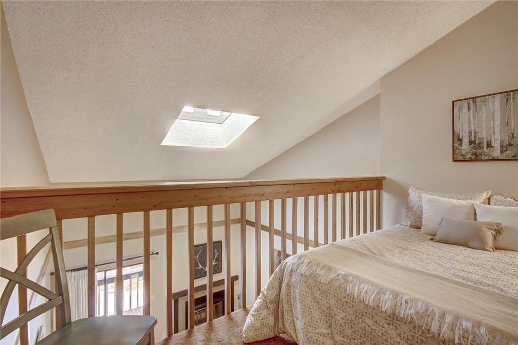 500 Bills Ranch Road, Unit 321 Frisco, CO 80443 - Photo 13 of 27 a bedroom with a bed and a large window