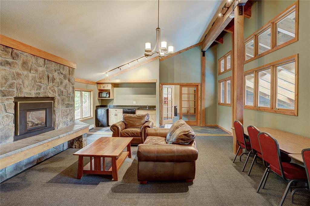 500 Bills Ranch Road, Unit 321 Frisco, CO 80443 - Photo 27 of 27 a living room with furniture a fireplace and a flat screen tv