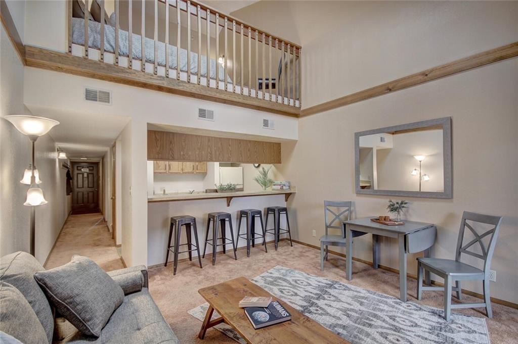 500 Bills Ranch Road, Unit 321 Frisco, CO 80443 - Photo 6 of 27 a living room with furniture a rug and a table