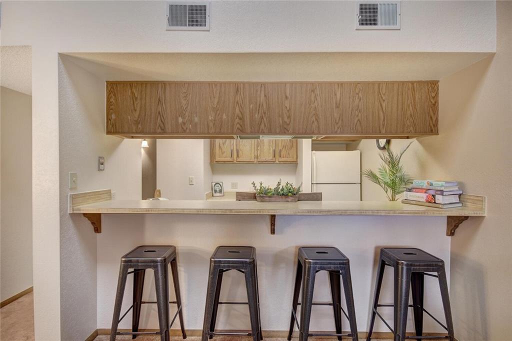 500 Bills Ranch Road, Unit 321 Frisco, CO 80443 - Photo 10 of 27 a kitchen with a table and chairs in it