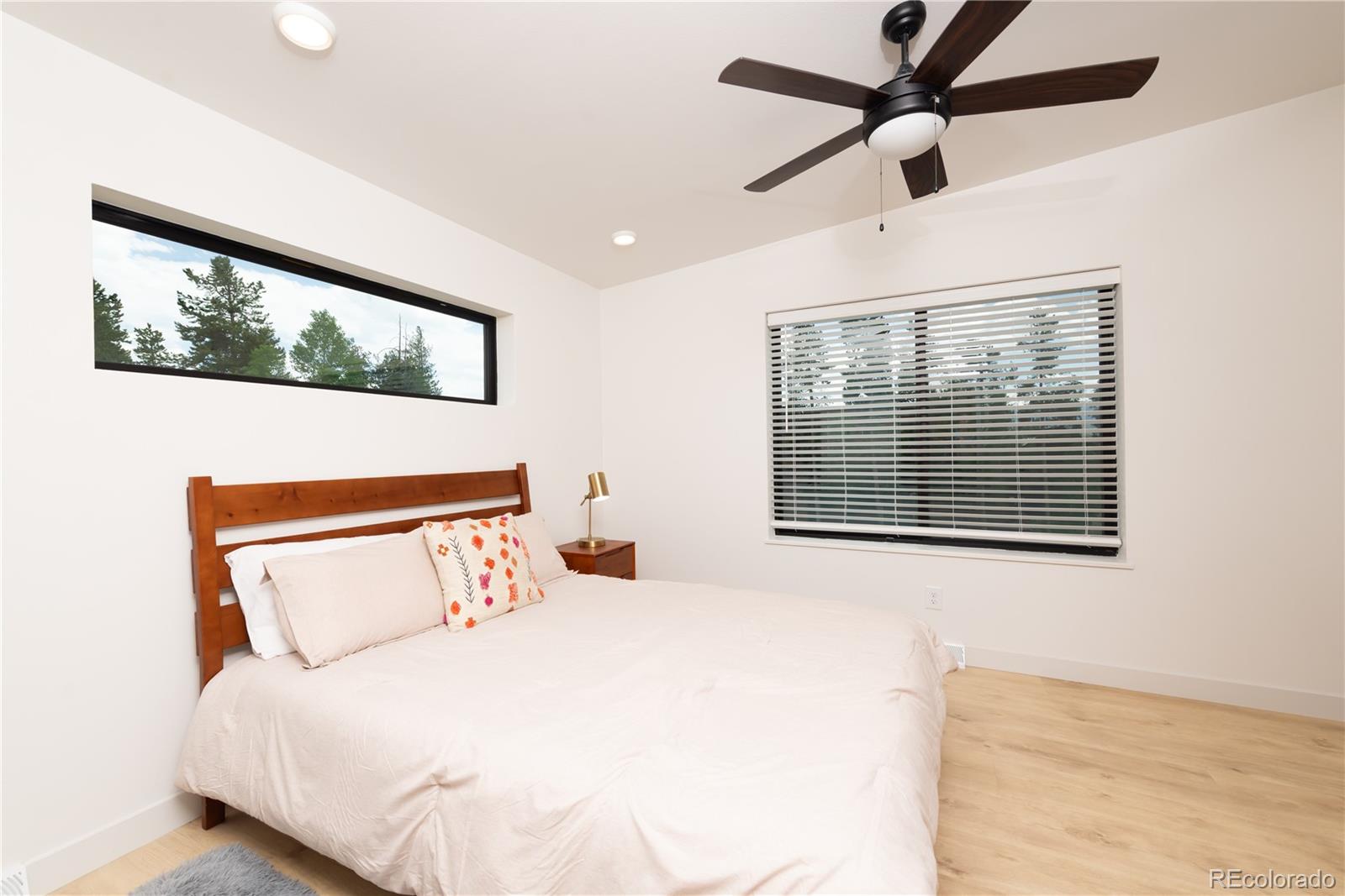 853 Ferret Lane Fraser, CO 80442 - Photo 17 of 32 a bedroom with a large bed and a window