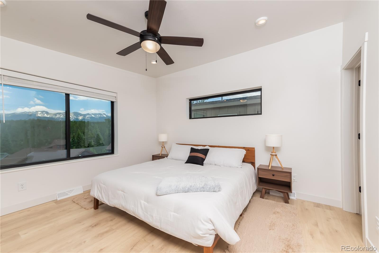 853 Ferret Lane Fraser, CO 80442 - Photo 22 of 32 a bedroom with a bed and window