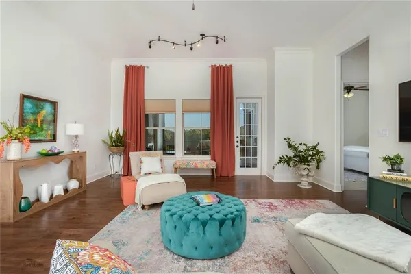 a living room with furniture and a large window