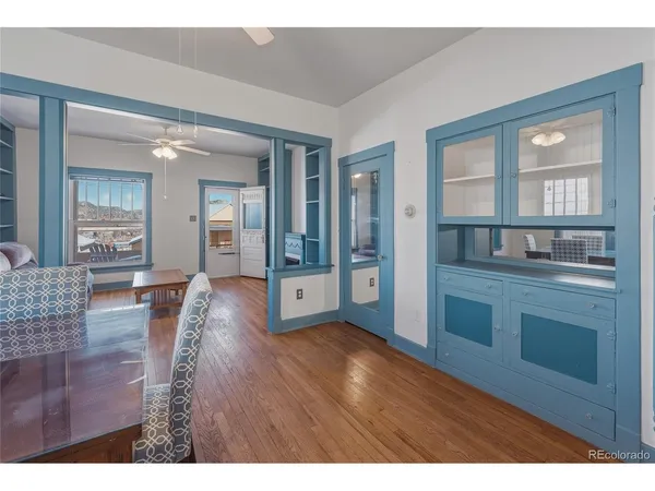 a view of a dining room with furniture and wooden floor
