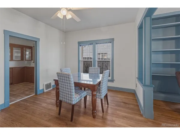 a kitchen with stainless steel appliances granite countertop a refrigerator and a stove