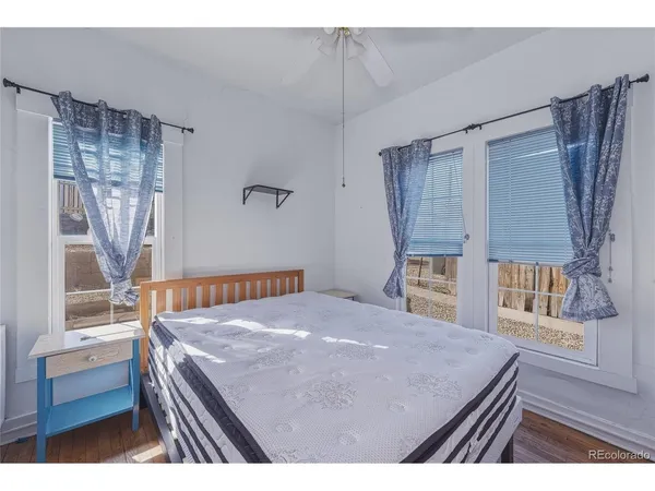a bedroom with a bed and a television