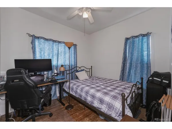 a bedroom with a bed and a night stand