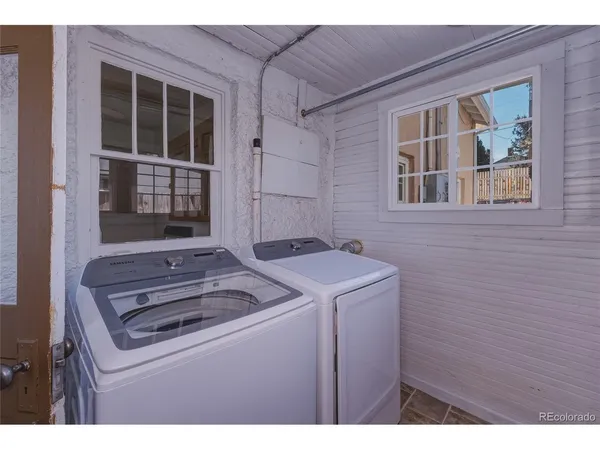 a view of a kitchen with sink dryer and washer