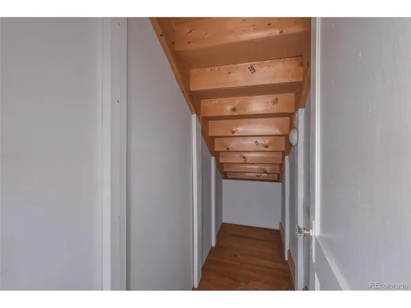 a view of walk in closet with clothes