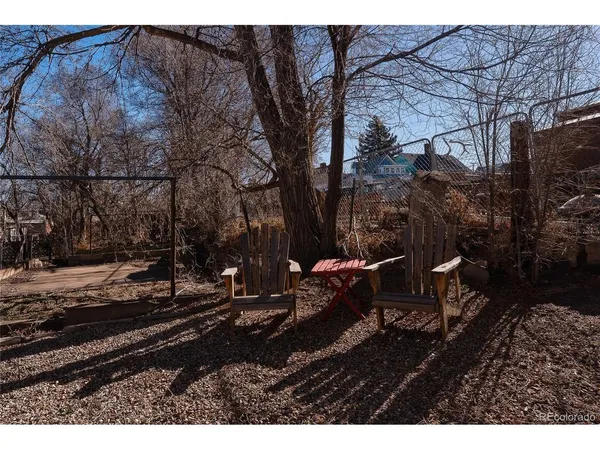a view of balcony with furniture and wooden floor