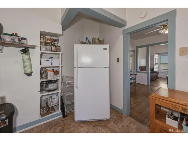 a kitchen with stainless steel appliances a refrigerator and a stove