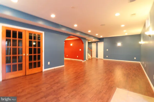 a view of a patio with dining table and chairs with wooden floor