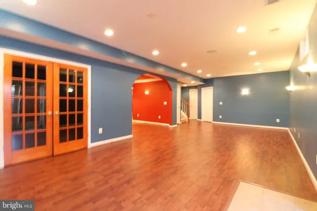 a view of a patio with dining table and chairs with wooden floor
