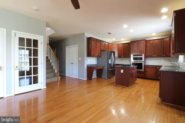 a view of kitchen with wooden floor