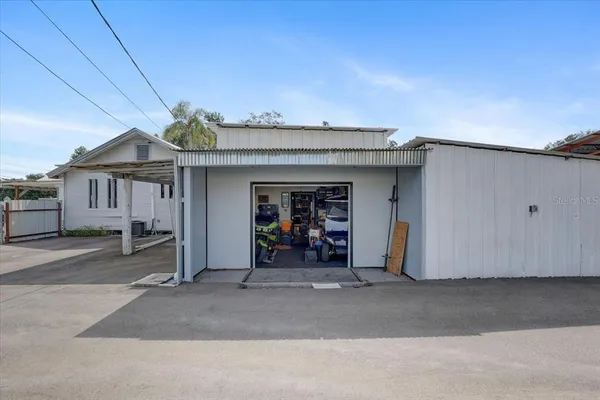 a kitchen with stainless steel appliances granite countertop a sink and a refrigerator