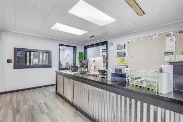 a kitchen with stainless steel appliances granite countertop a sink and a refrigerator