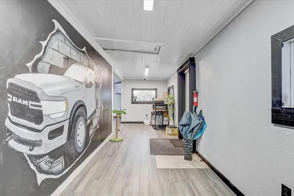 a room with lots of furniture and air hockey table