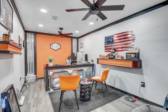 a room with lots of furniture and air hockey table