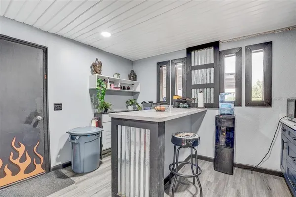 a reading room with furniture and wooden floor