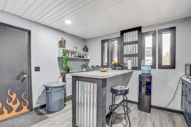 a reading room with furniture and wooden floor