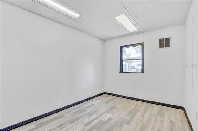 a view of a swimming pool with a lawn chairs