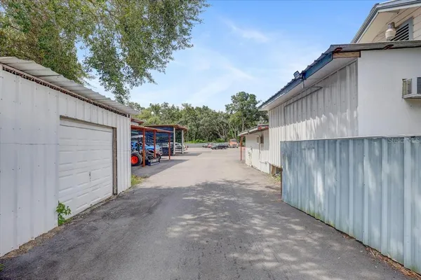 a view of a street with a cars park side of road
