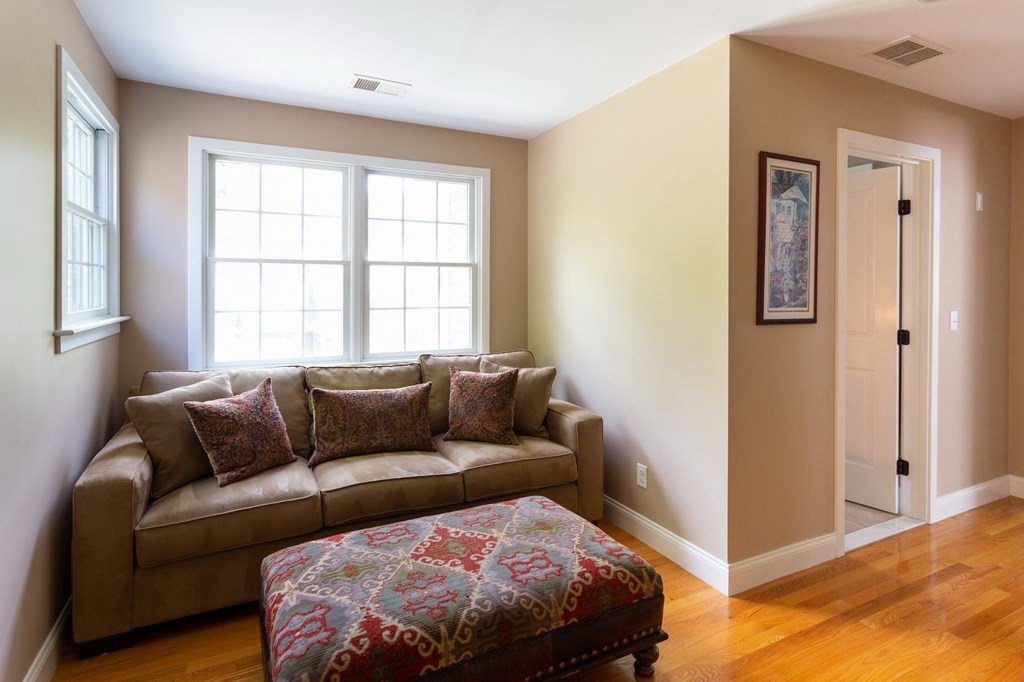 6 North Street Mashpee, MA 02649 - Photo 13 of 22 a bedroom with a bed couch and window