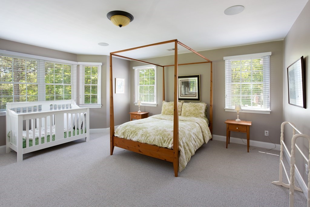 6 North Street Mashpee, MA 02649 - Photo 14 of 22 a spacious bedroom with a bed and window